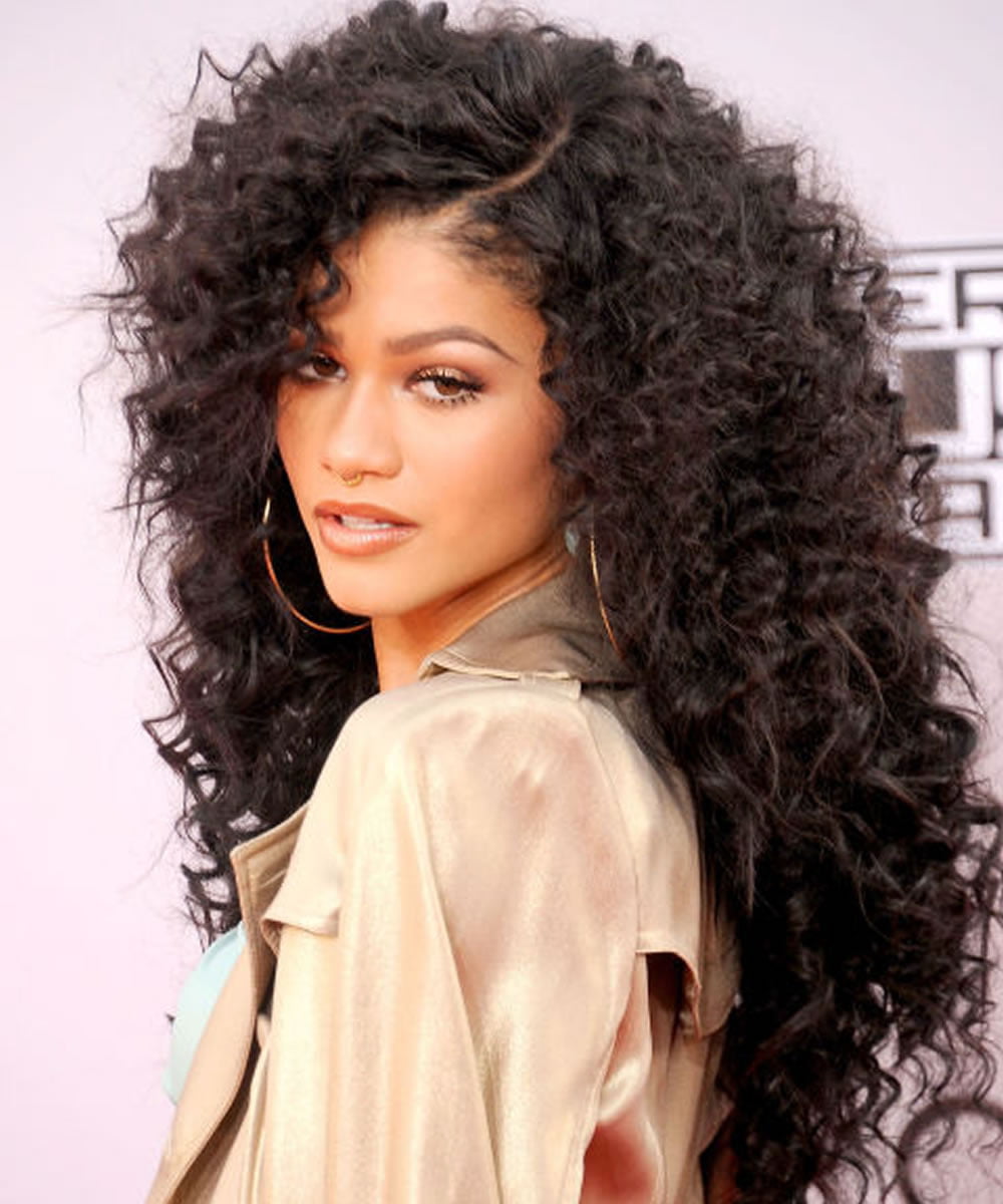 woman with natural long curly hair, mid length